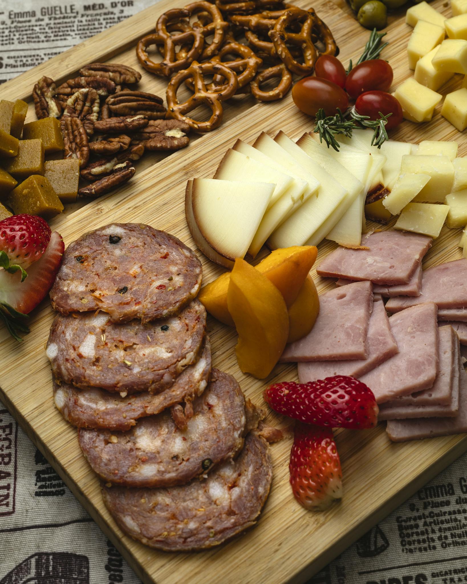 Appetizing charcuterie board featuring meats, cheeses, fruits, and nuts, perfect for gatherings.